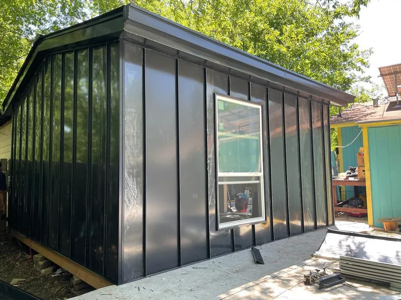 Black standing seam metal wall panels for Metal Roof Installation in Groveton