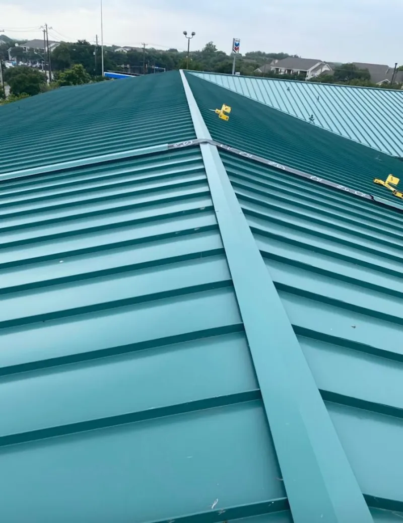 Green commercial metal roof ridge and valley for Metal Roof Repair in Groveton